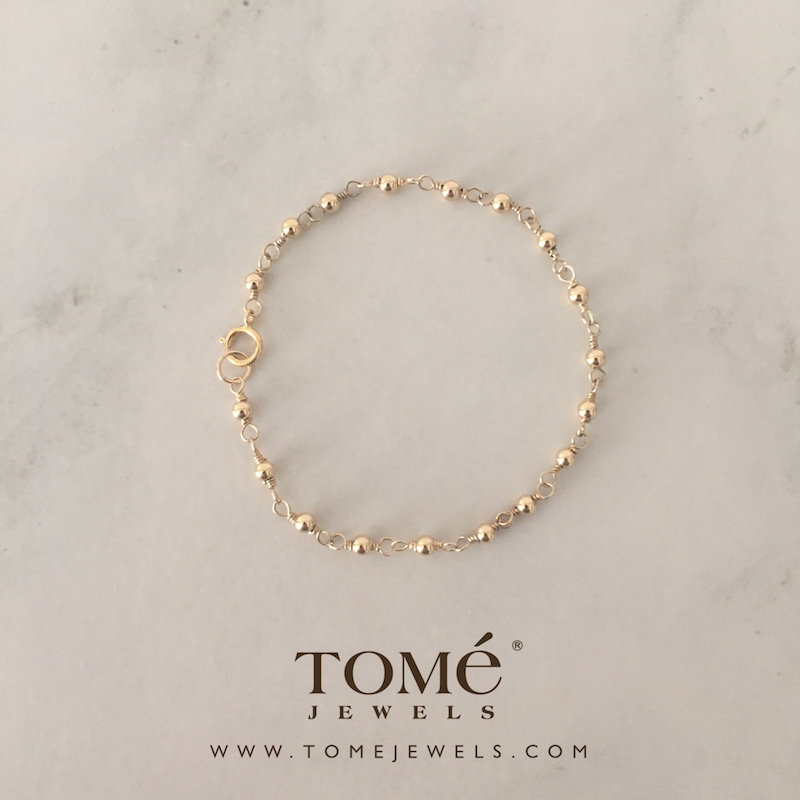 Pulsera con Cuentas Doradas